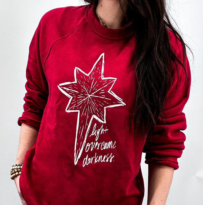 Christmas Sweatshirt / Light Overcomes Darkness - Cranberry & Evergreen